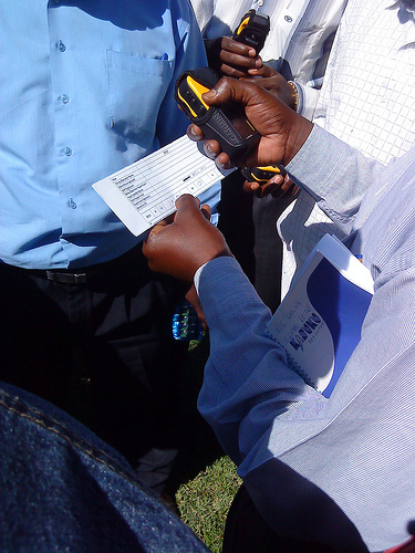 Spray team mappers learning to use the GPS data system in 2011.