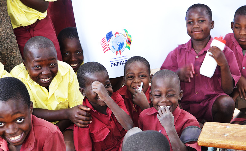 Photo of children in Zimbabwe attending a ZimHISP project activity.